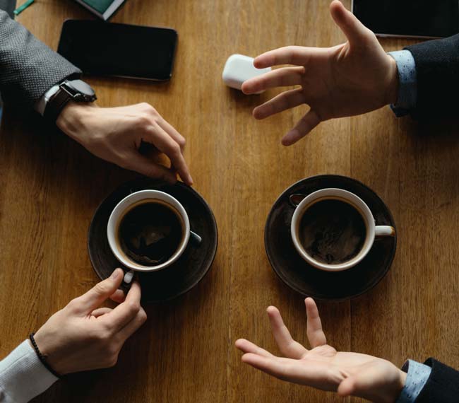 Men Hands Gesticulating While Holding Cups Coffee
